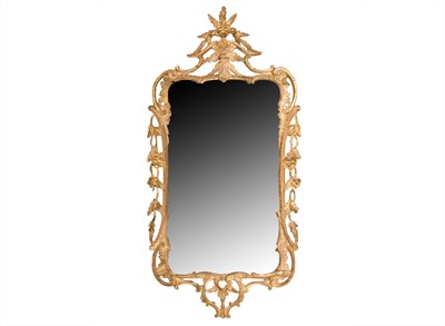 Lot 309 - A CARVED GILTWOOD MIRROR IN THE MANNER OF THOMAS CHIPPENDALE