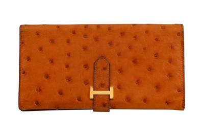 Lot 194 - λ Hermes Gold Ostritch Bearn Bi-Fold Wallet