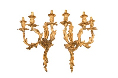 Lot 338 - A PAIR OF ROCOCO STYLE GILT BRASS THREE-BRANCH WALL SCONCES, LATE 19TH/EARLY 20TH CENTURY