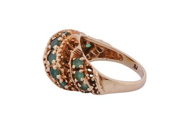 Lot 157 - AN EMERALD BOMBÉ RING, CIRCA 1979