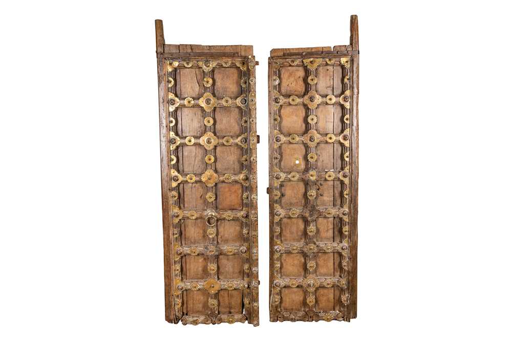 Lot 86 - A PAIR OF INDIAN CARVED HARDWOOD DOORS, 19TH CENTURY