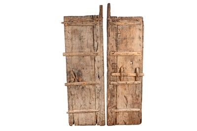 Lot 86 - A PAIR OF INDIAN CARVED HARDWOOD DOORS, 19TH CENTURY