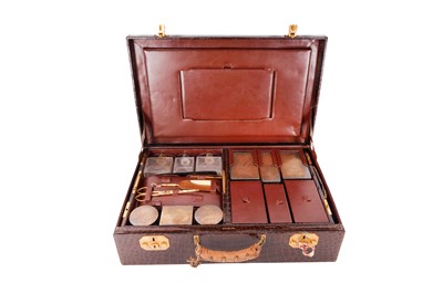 Lot 64 - A George V sterling silver gilt fitted travelling vanity or dressing case, London 1935 by Cartier