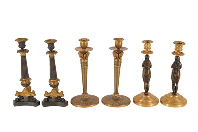 Lot 433 - THREE PAIRS OF LATE 19TH CENTURY FRENCH EMPIRE-STYLE GILT AND PATINATED METAL CANDLESTICKS