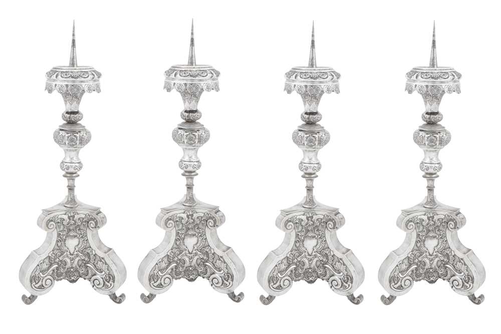 Lot 296 - A set of four mid-18th century German silver altar candlesticks (altarleuchter), Augsburg 1745-47 by Franz Christoph Mederle (master 1729, d. 1765)