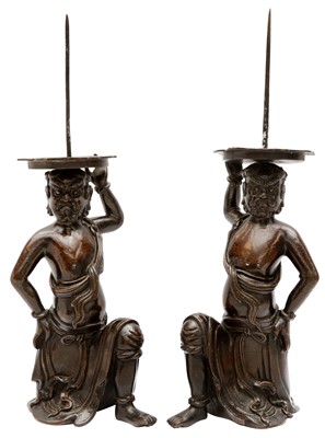 Lot 200 - A PAIR OF FINE AND RARE CHINESE BRONZE 'FOREIGNER' PRICKET CANDLESTICKS