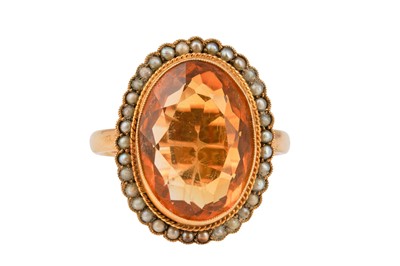 Lot 22 - BRAVINGTONS | A CITRINE AND SEED PEARL RING, CIRCA 1947