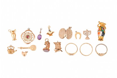 Lot 93 - A GROUP OF CHARMS AND RINGS