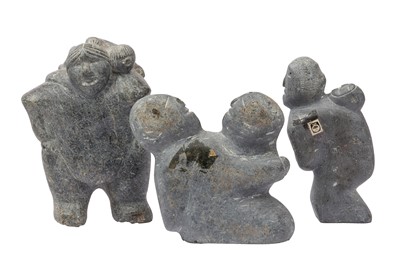 Lot 400 - A GROUP OF THREE CARVED STONE INUIT SCULPTURES