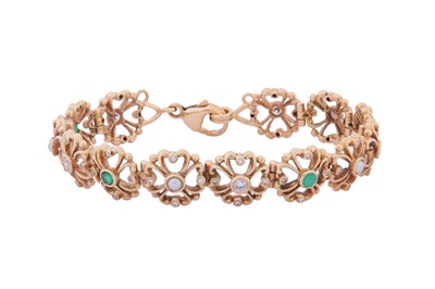 Lot 253 - AN EMERALD AND PEARL ARTICULATED BRACELET