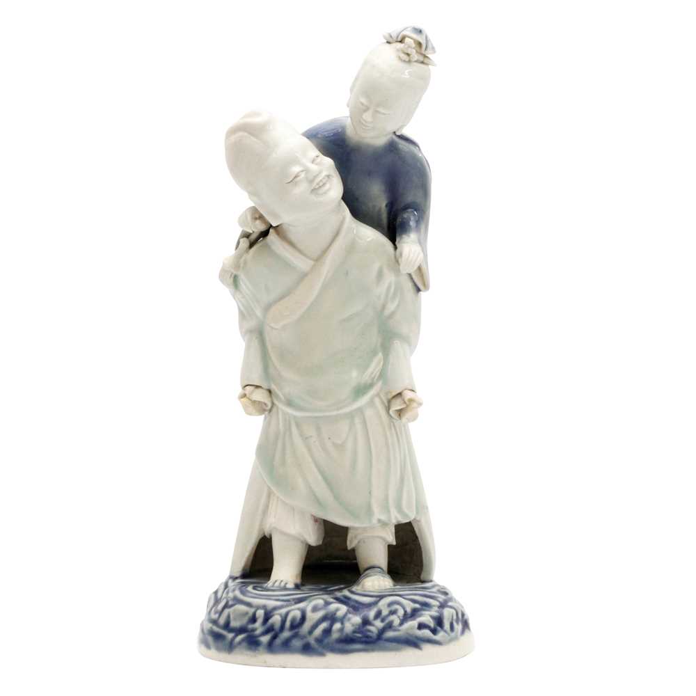 Lot 473 - A Chinese glazed biscuit figure group, Qing dynasty, Qianlong period