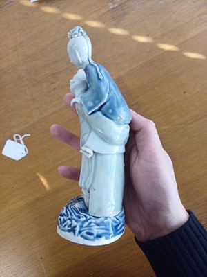 Lot 473 - A Chinese glazed biscuit figure group, Qing dynasty, Qianlong period