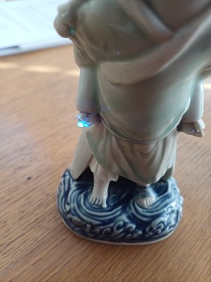 Lot 473 - A Chinese glazed biscuit figure group, Qing dynasty, Qianlong period