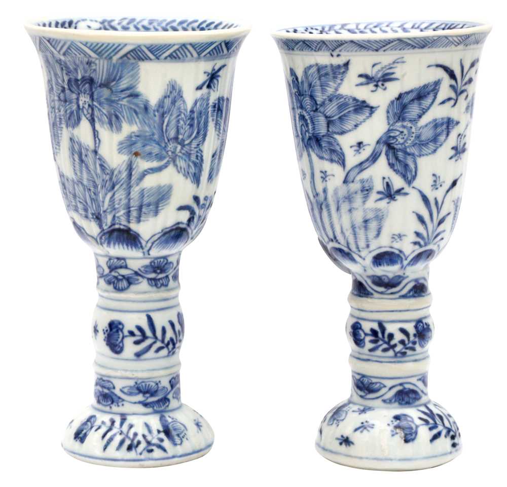 Lot 433 - A pair of Chinese blue and white goblets, Qing dynasty, Kangxi period