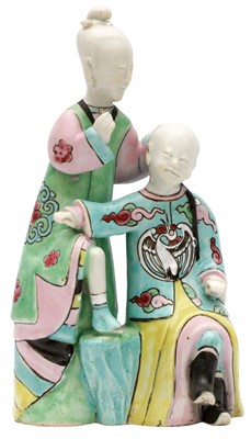 Lot 80 - A CHINESE FAMILLE-ROSE 'EAR CLEANING' FIGURE GROUP