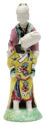 Lot 75 - A RARE CHINESE FAMILLE-ROSE 'MAN CARRYING LADY' FIGURE