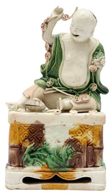 Lot 31 - A CHINESE FAMILLE-VERTE BISCUIT 'DAOIST IMMORTAL' FIGURE