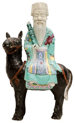 Lot 68 - A CHINESE FAMILLE-ROSE FIGURE OF AN IMMORTAL RIDING A HORSE