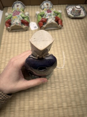 Lot 429 - A Chinese biscuit figure of an official, Qing dynasty, Kangxi period