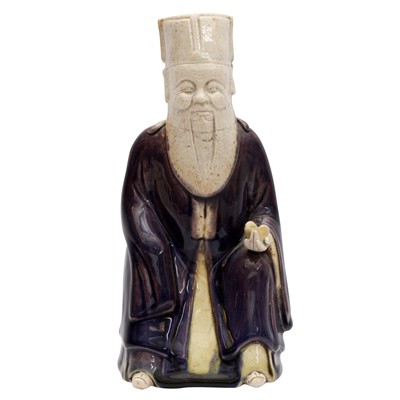 Lot 429 - A Chinese biscuit figure of an official, Qing dynasty, Kangxi period