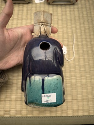 Lot 429 - A Chinese biscuit figure of an official, Qing dynasty, Kangxi period