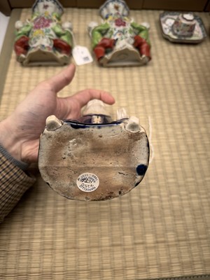 Lot 429 - A Chinese biscuit figure of an official, Qing dynasty, Kangxi period