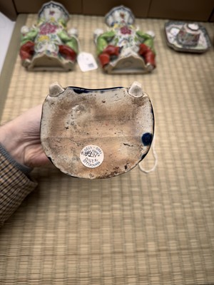 Lot 429 - A Chinese biscuit figure of an official, Qing dynasty, Kangxi period