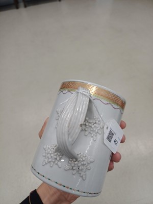 Lot 462 - A Chinese famille-rose armorial mug, Qing dynasty, Qianlong period