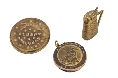 Lot 280 - A group of three early 20th century novelty brass vesta cases