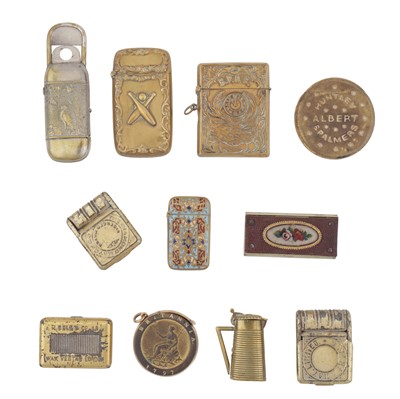 Lot 528 - A group of three early 20th century novelty brass vesta cases