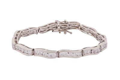 Lot 147 - A DIAMOND LINE BRACELET