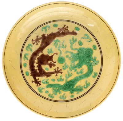 Lot 143 - A CHINESE GREEN AND AUBERGINE YELLOW-GROUND DISH