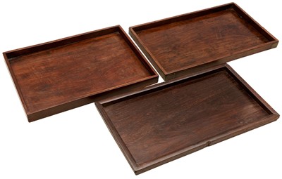 Lot 222 - THREE CHINESE HARDWOOD HUANGHUALI TRAYS