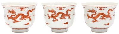 Lot 117 - THREE CHINESE IRON-RED 'DRAGON' CUPS