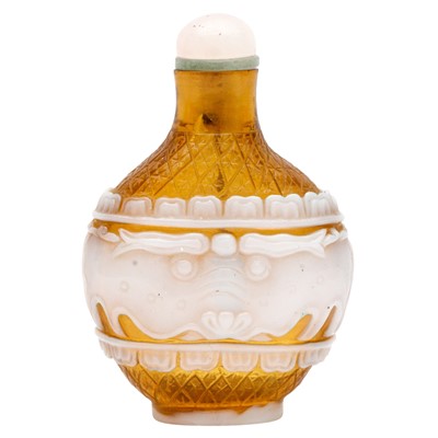 Lot 728 - A Chinese Beijing overlay glass 'archaistic' overlay snuff bottle, 19th century