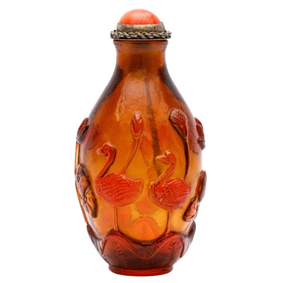 Lot 726 - A Chinese amber-coloured Beijing glass 'lotus pond' snuff bottle, 19th century