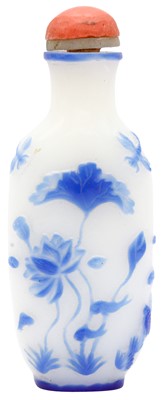 Lot 267 - A CHINESE BLUE OVERLAY GLASS 'LOTUS POND' SNUFF BOTTLE