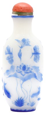 Lot 267 - A CHINESE BLUE OVERLAY GLASS 'LOTUS POND' SNUFF BOTTLE
