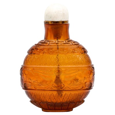 Lot 713 - A Chinese amber-coloured glass 'archaistic' snuff bottle, 19th century
