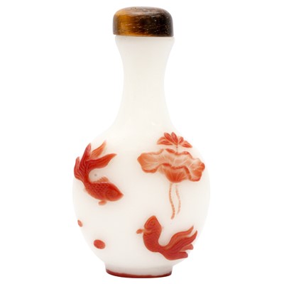 Lot 718 - A Chinese red overlay 'lotus pond' snuff bottle, 19th century