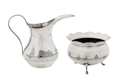 Lot 242 - An early 20th century Iraqi silver and niello milk jug and sugar bowl, Omara circa 1930, signed Abed Al Jabbar