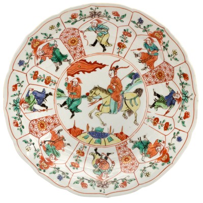 Lot 25 - A CHINESE FAMILLE-VERTE LOTUS-MOULDED 'MU GUIYING' DISH