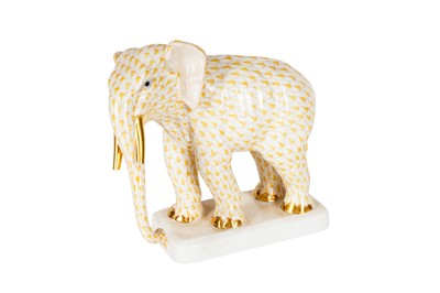 Lot 113 - A HEREND PORCELAIN BUTTERSCOTCH FISHNET MODEL OF AN ELEPHANT