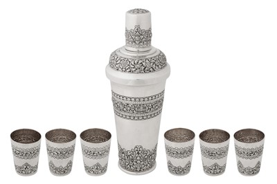 Lot 169 - A mid-20th century Cambodian silver cocktail shaker and cups set, circa 1960 retailed by Paong