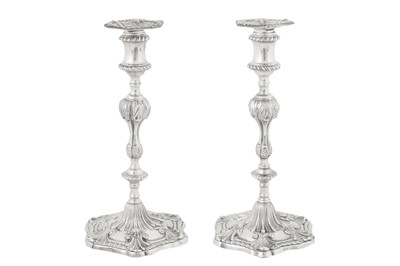 Lot A pair of George III Irish sterling silver candlesticks, Dublin 1776 by William Hughes (active 1767-84)