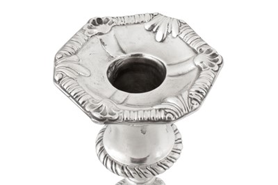 Lot 470 - A pair of George III Irish sterling silver candlesticks, Dublin 1776 by William Hughes (active 1767-84)