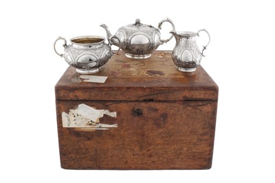 Lot 405 - A cased Victorian sterling silver three – piece tea service, London 1862 by Samuel Hayne and Dudley Cater