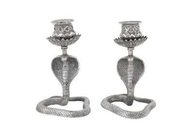 Lot 111 - A pair of early 20th century Anglo – Indian unmarked silver candlesticks, Cutch or Bombay circa 1910