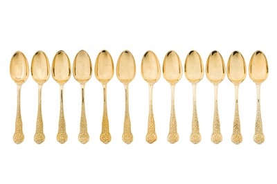 Lot 345 - A rare set of twelve Victorian sterling silver gilt dessert service dessert spoons, London 1850 by George Adams of Chawner and Co