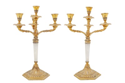 Lot 286 - A pair of mid-20th century Italian 800 standard silver gilt four-light candelabra, 1934-44, maker’s mark obscured, retailed by Pinci Roma